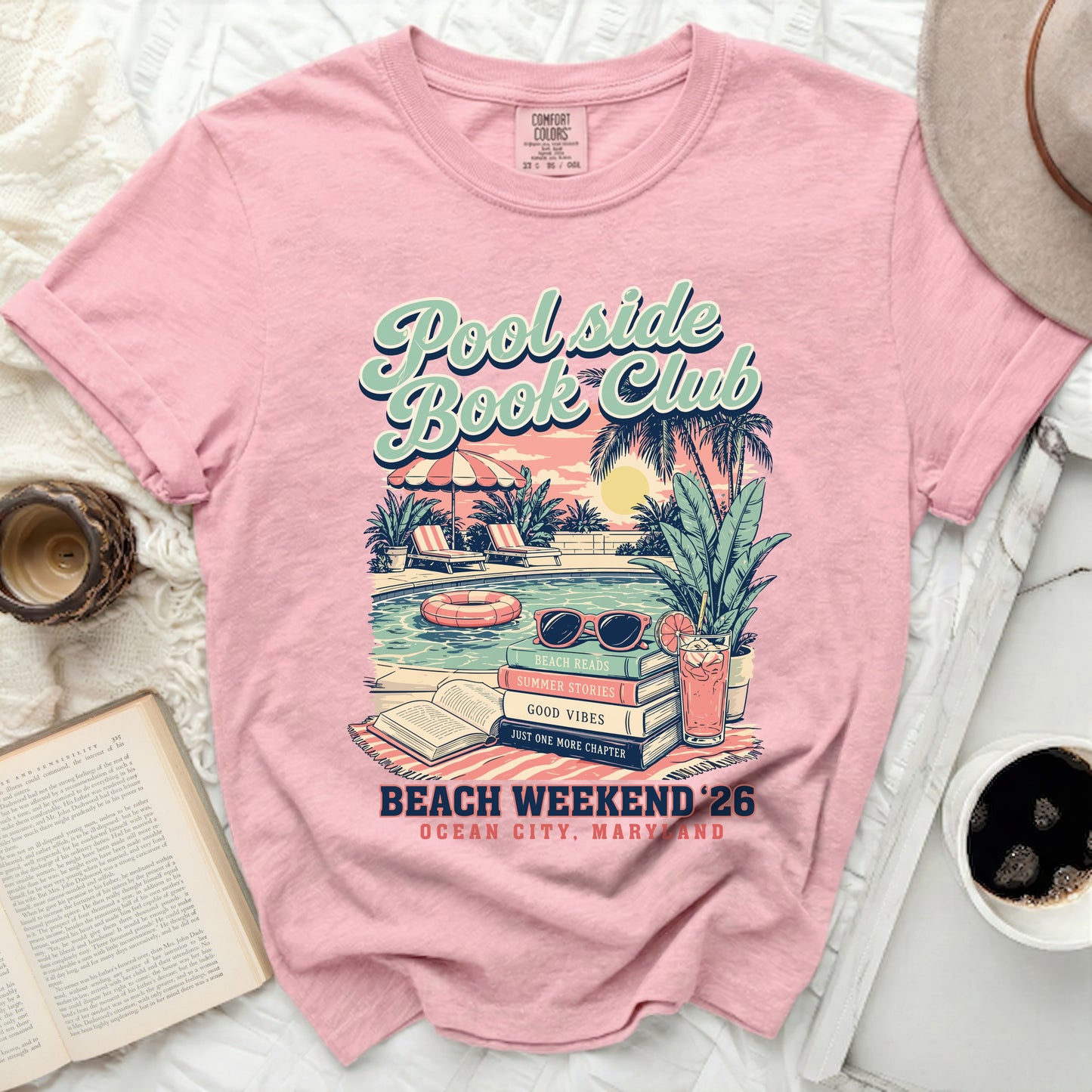Pink t-shirt with "Poolside Book Club" graphic, beach reads, and Ocean City, Maryland text.