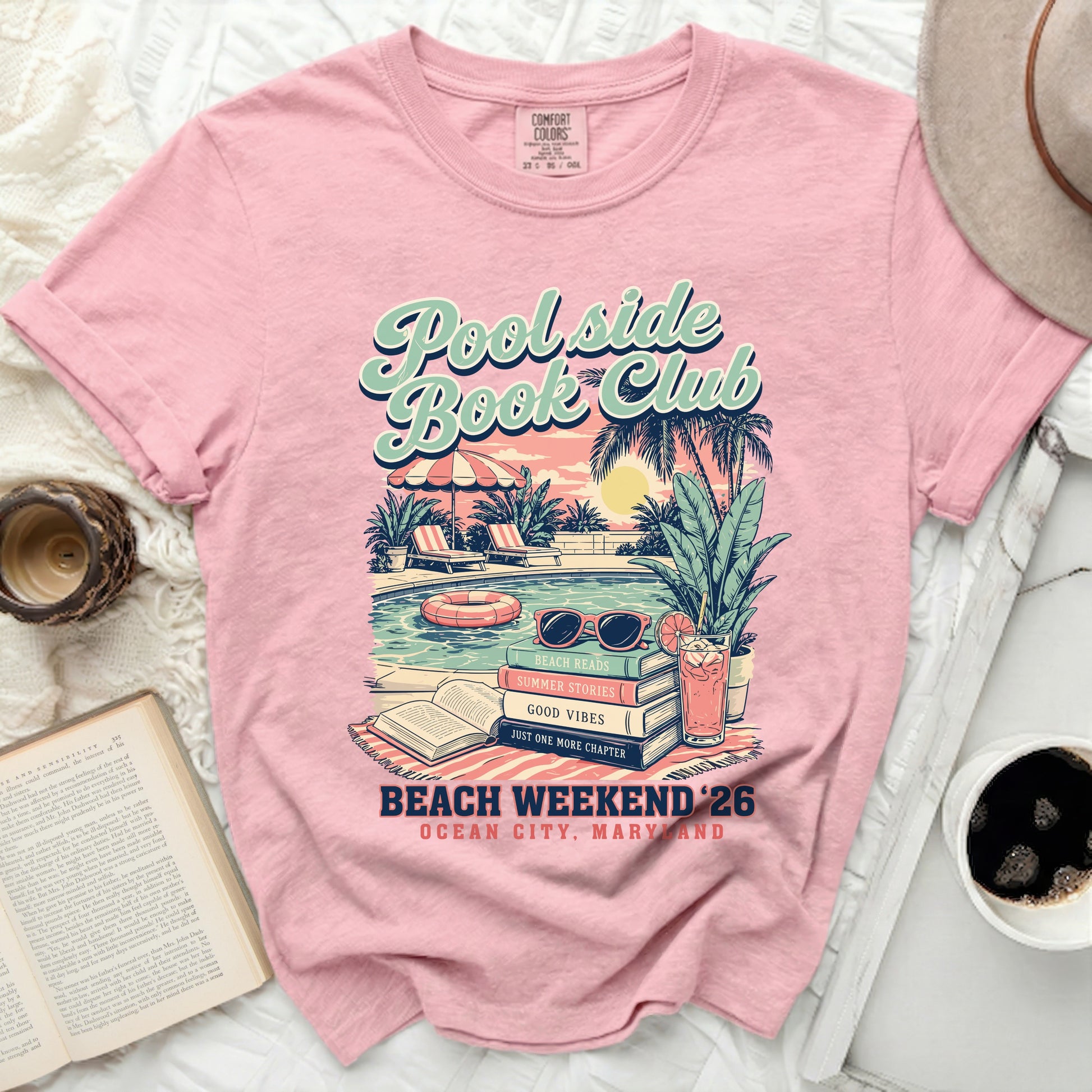 Pink t-shirt with "Poolside Book Club" graphic, beach reads, and Ocean City, Maryland text.