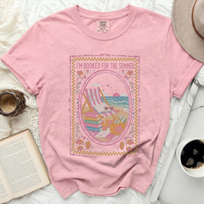 Pink t-shirt with "I'm Booked For The Summer" graphic featuring beach scene.