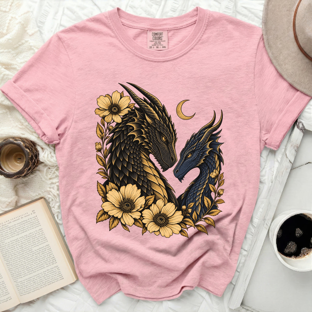 Pink t-shirt with two dragons and yellow flowers design, crescent moon above.