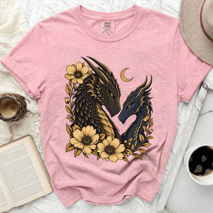 Pink t-shirt with two dragons and yellow flowers design, crescent moon above.
