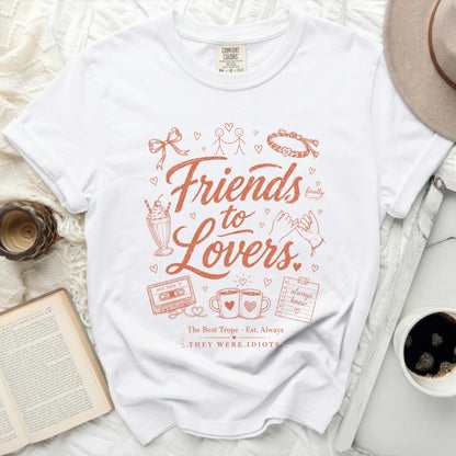 White t-shirt with "Friends to Lovers" graphic and cassette tape design.