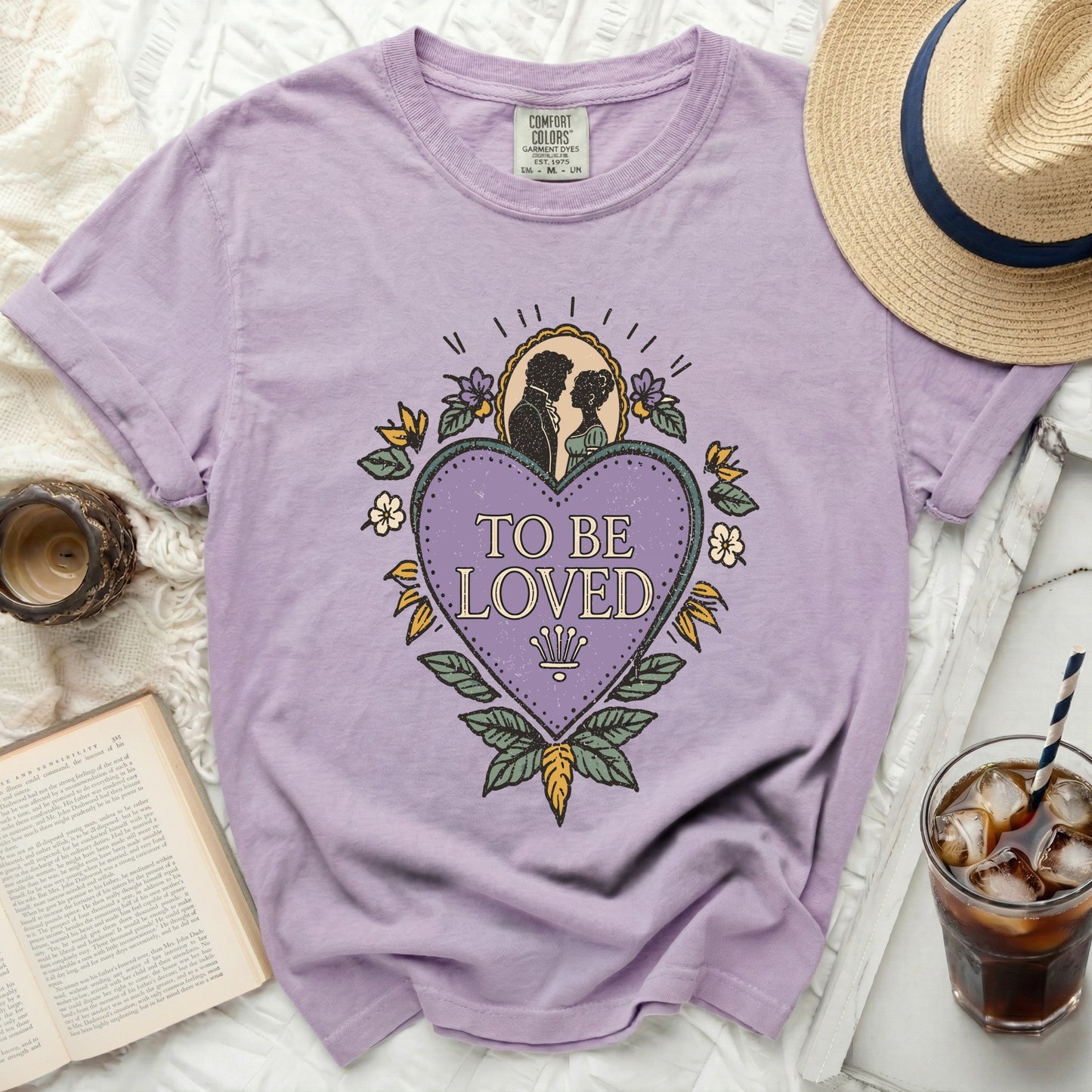 Lilac Comfort Colors t-shirt with "TO BE LOVED" heart graphic and couple silhouette.