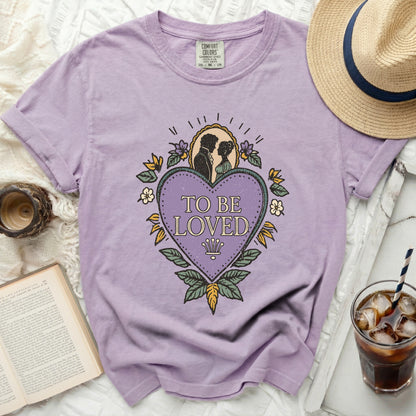 Lilac Comfort Colors t-shirt with "TO BE LOVED" heart graphic and couple silhouette.