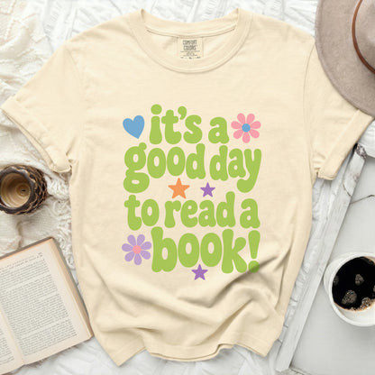 Cream t-shirt with "it's a good day to read a book!" graphic.