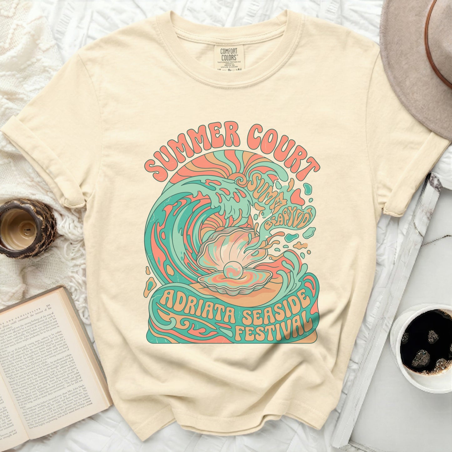 Cream t-shirt with "Summer Court Adriata Seaside Festival" graphic.