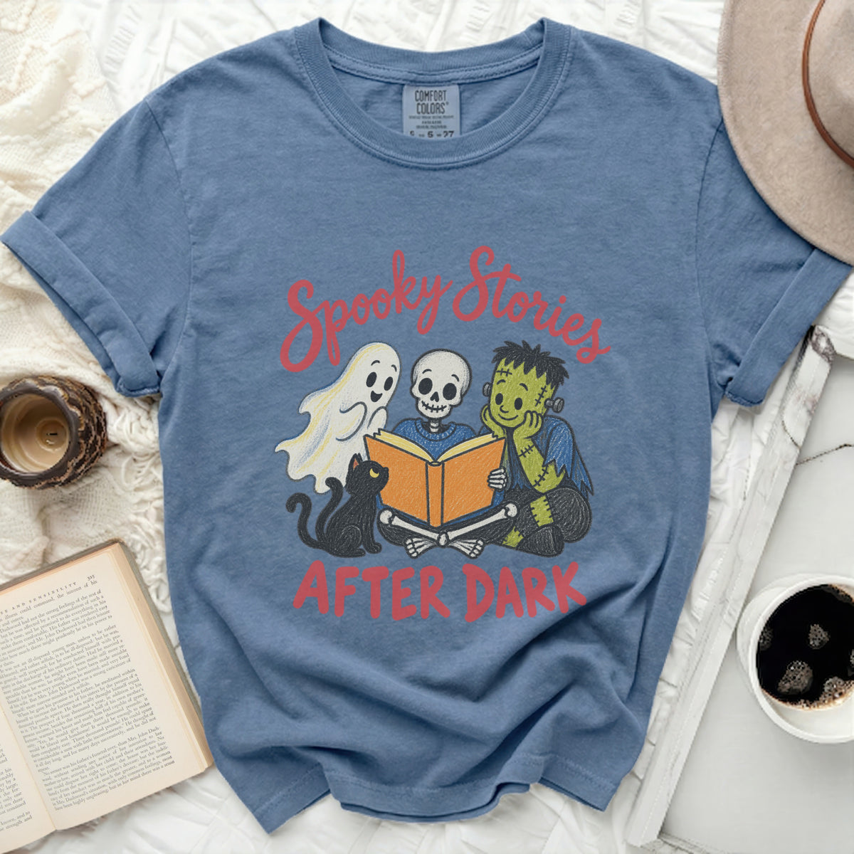 Spooky Stories After Dark t-shirt with ghost, skeleton, and Frankenstein characters.