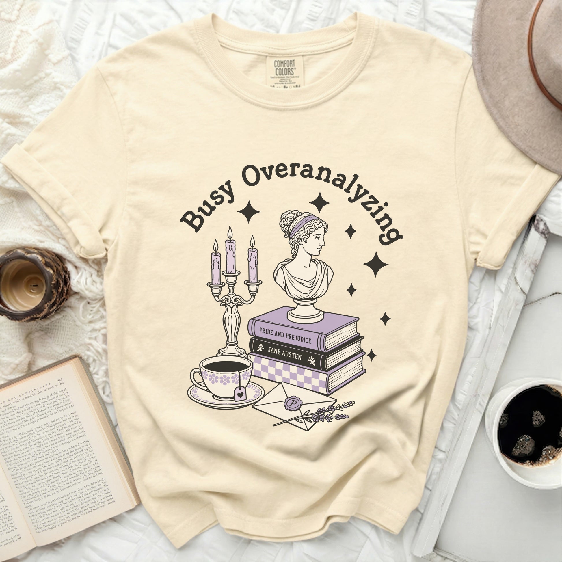 T-shirt with "Busy Overanalyzing" and a classic illustration of books.