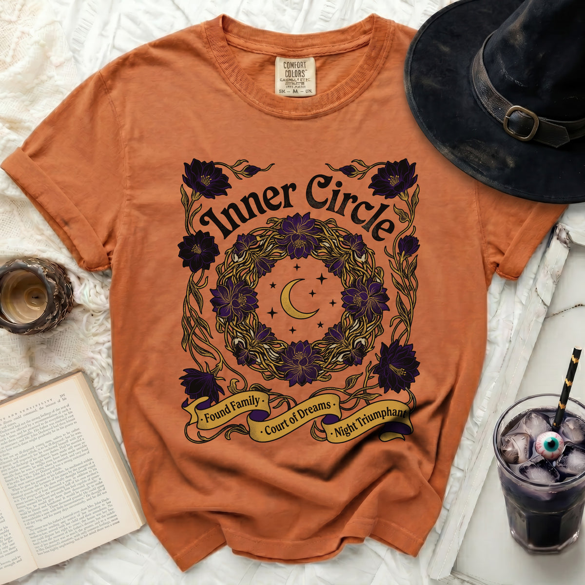 Orange t-shirt with "Inner Circle" and floral wreath design.