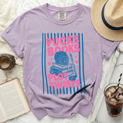 Graphic tee with "Pucks Books Plot Twists" text and hockey imagery.
