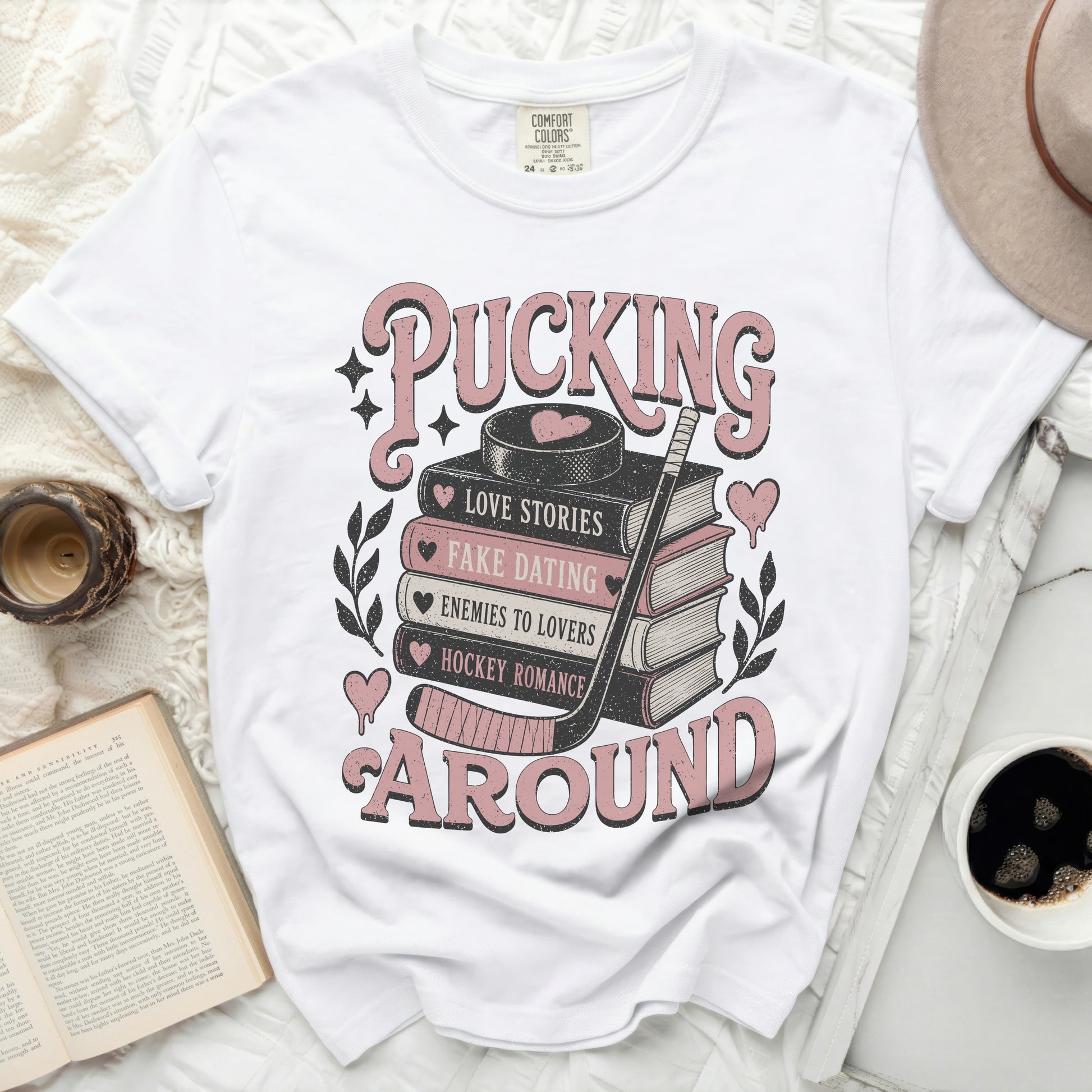 White t-shirt with "Pucking Around" and romance book genres graphic.
