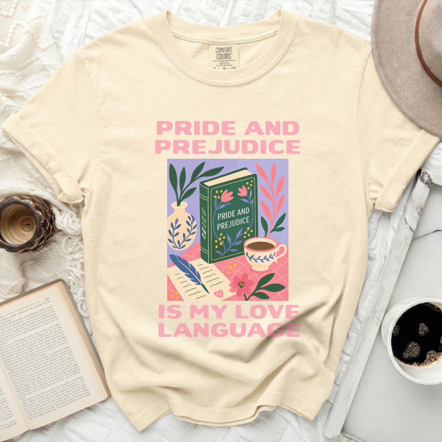 Cream t-shirt with "Pride and Prejudice is my love language" graphic.