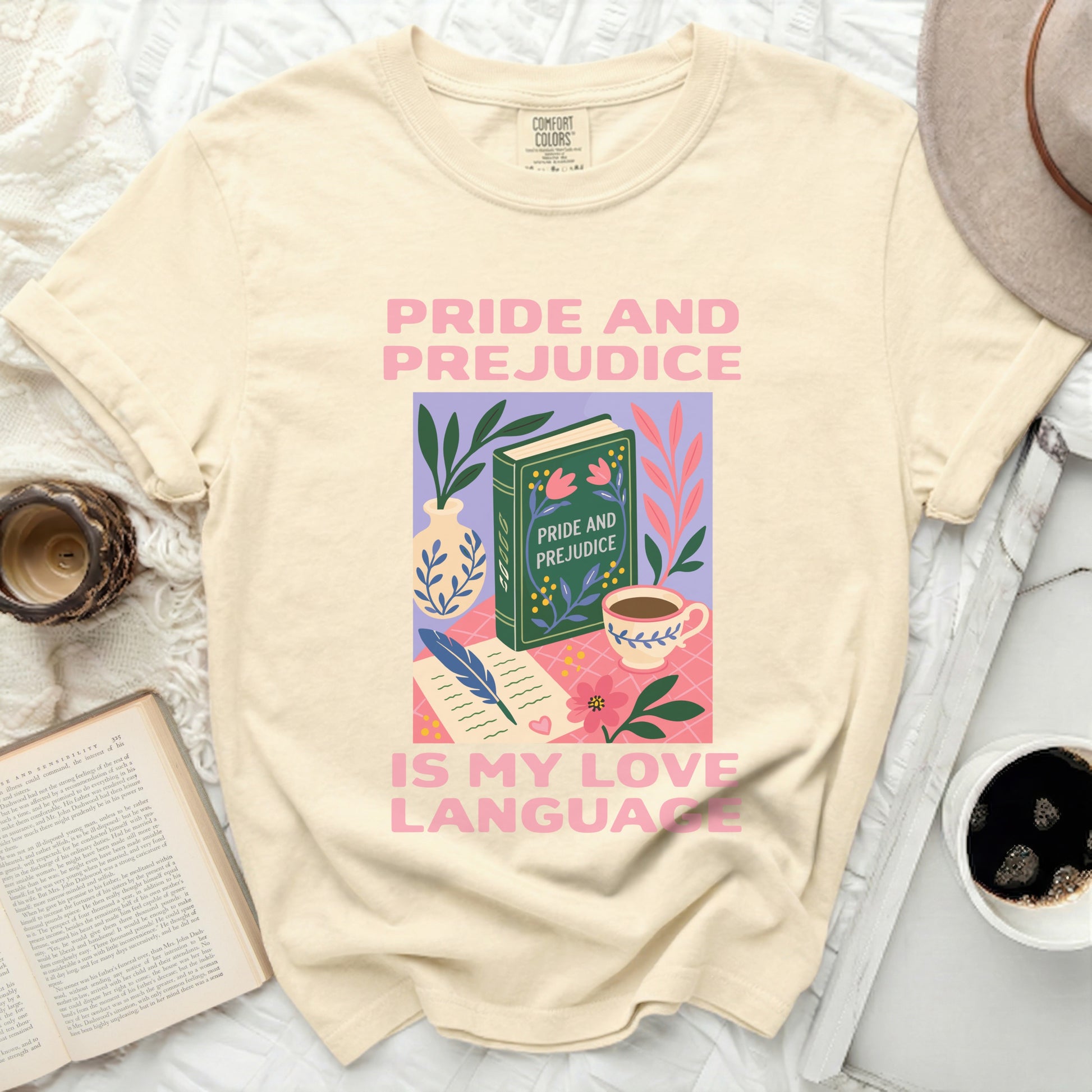 Cream t-shirt with "Pride and Prejudice is my love language" graphic.