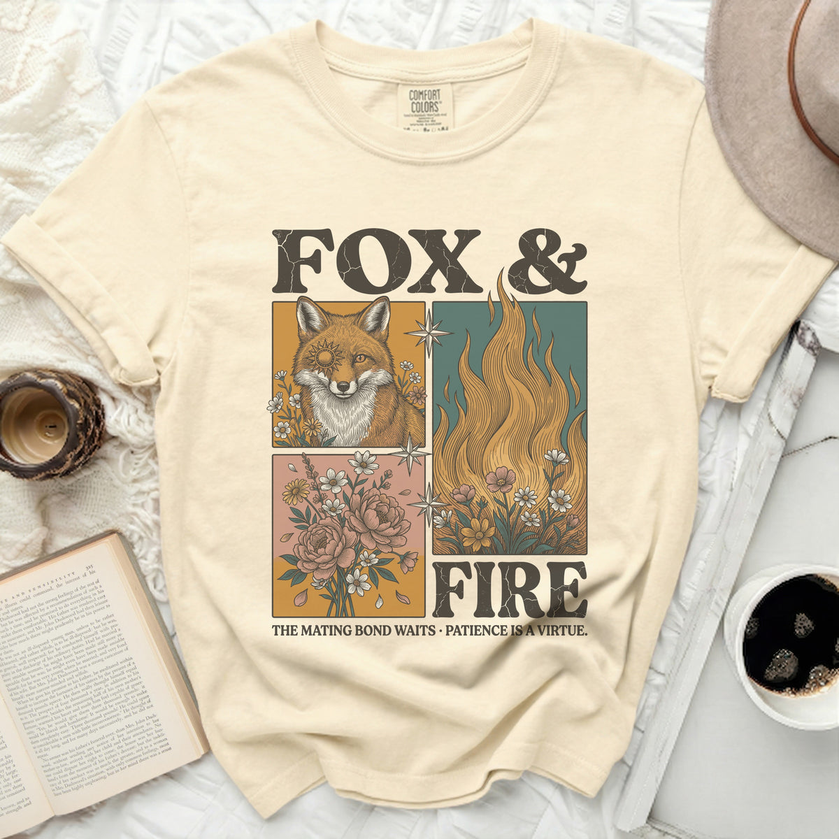 Cream t-shirt with "Fox & Fire" graphic, featuring a fox, flames, and flowers.