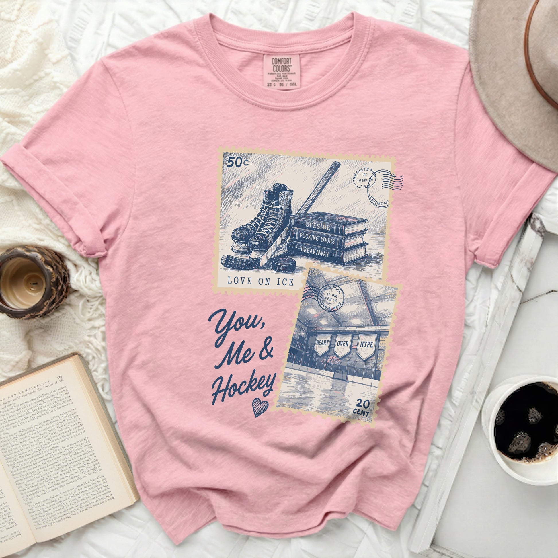 Pink t-shirt with vintage hockey stamp design and text "You, Me & Hockey".