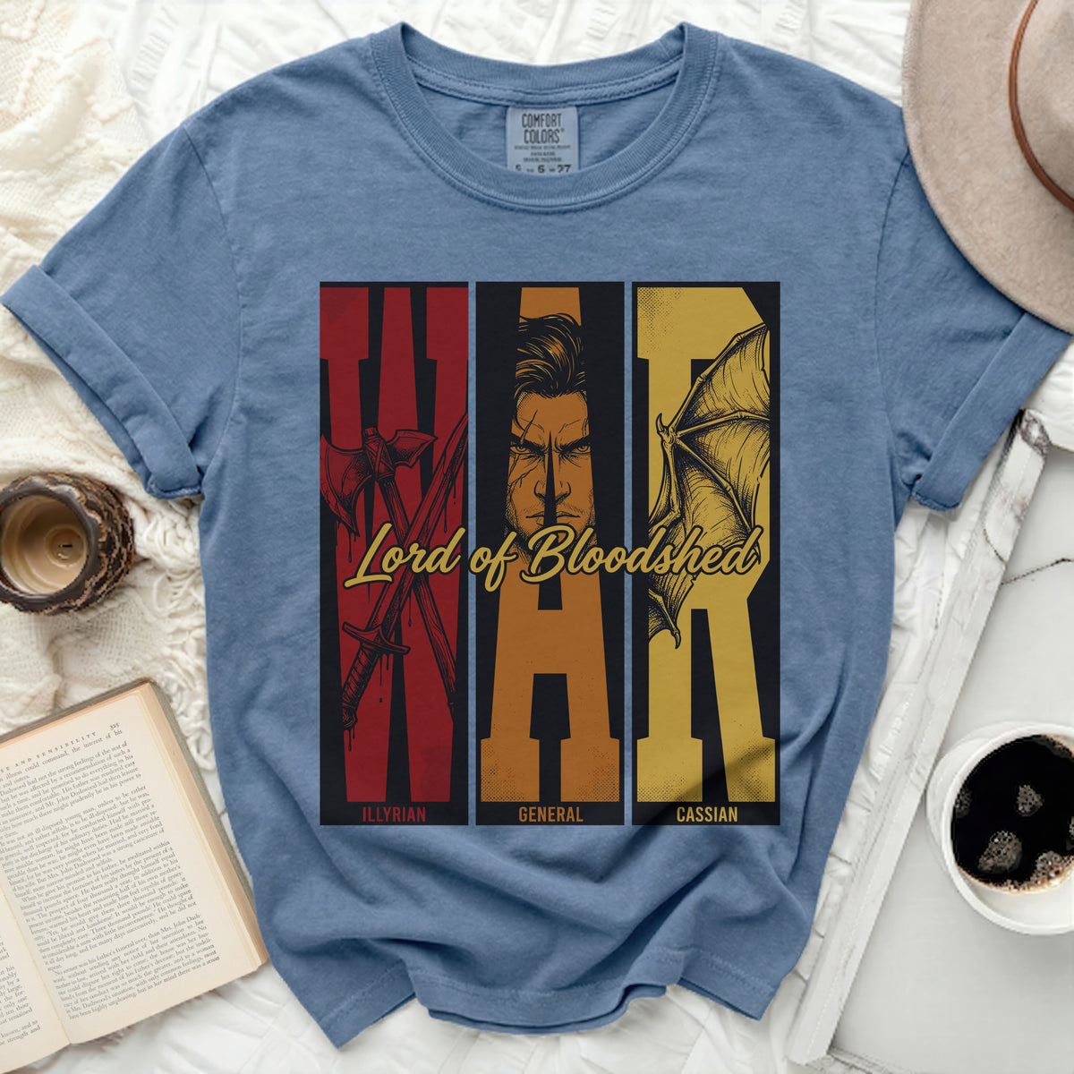 Blue t-shirt with "Lord of Bloodshed" and WAR design featuring axes, a man's face, and wings.