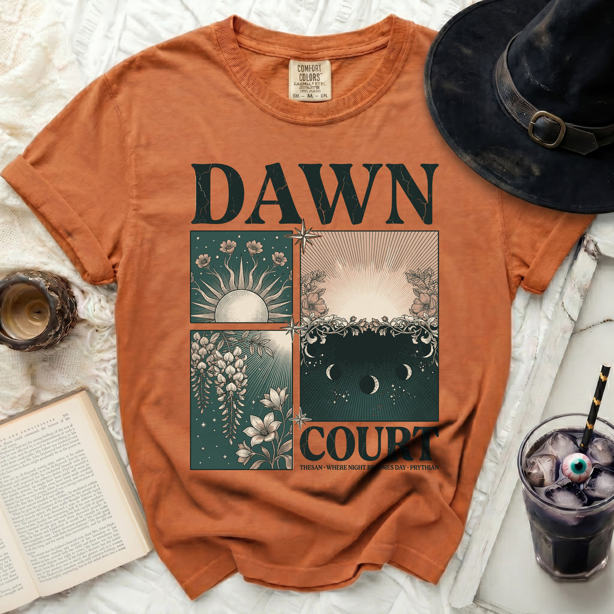 Orange t-shirt with "Dawn Court" and celestial graphics.