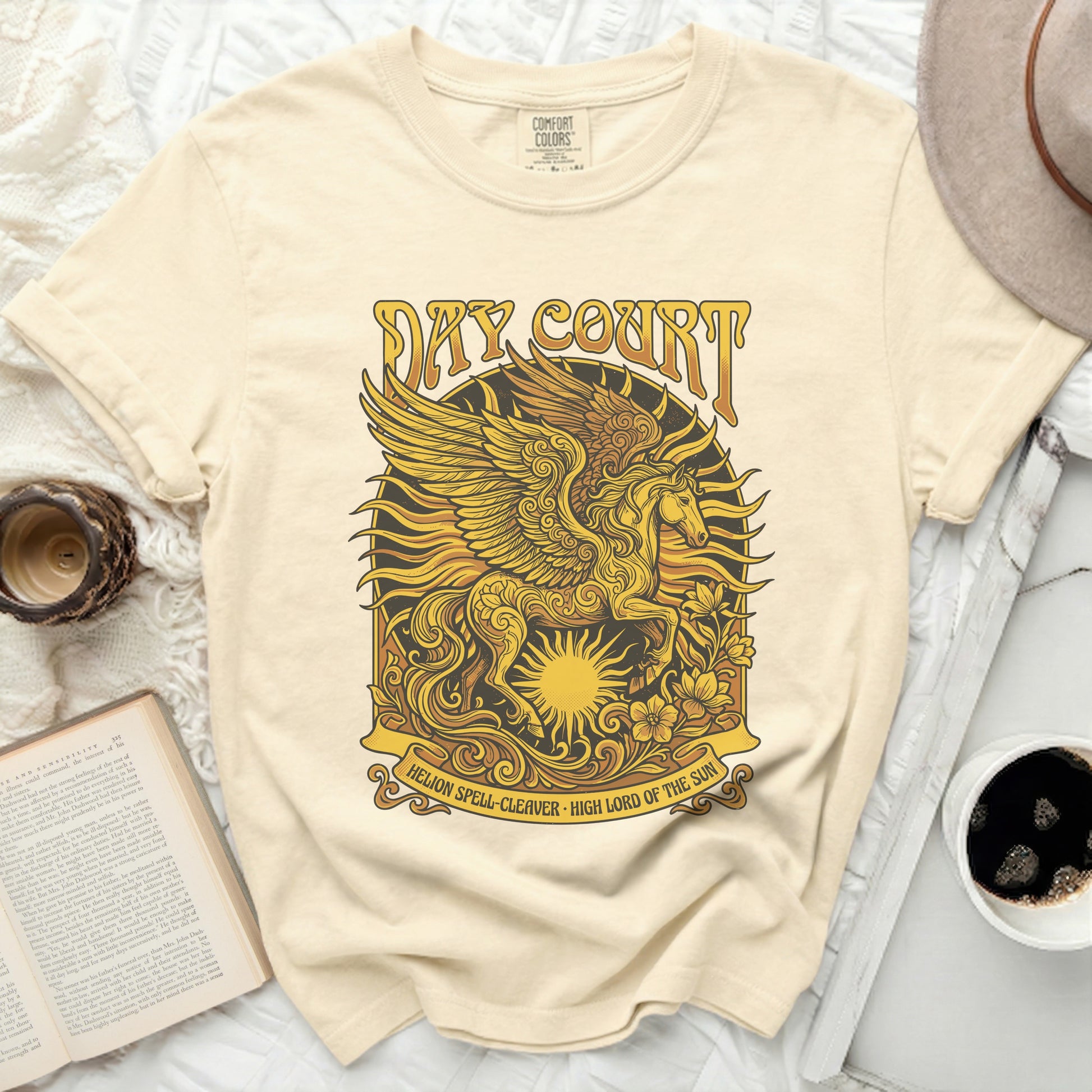 Cream t-shirt with winged horse and sun graphic, "Day Court" text.