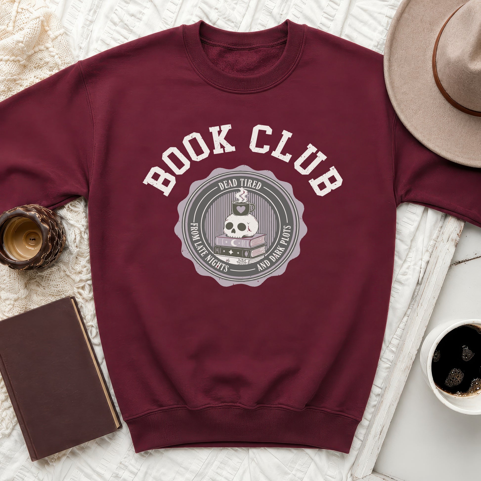 Maroon sweatshirt with "Book Club" and skull graphic.