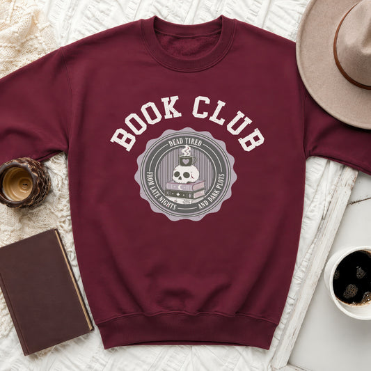 Maroon sweatshirt with "Book Club" and skull graphic.