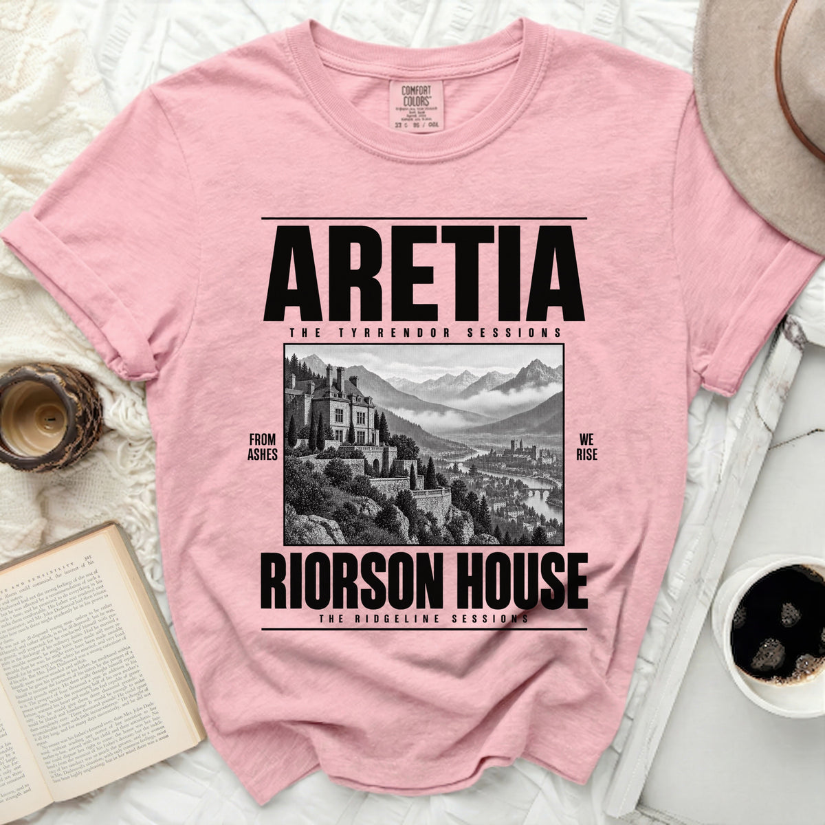 Pink Comfort Colors t-shirt with "ARETIA RIORSON HOUSE" and a castle graphic.