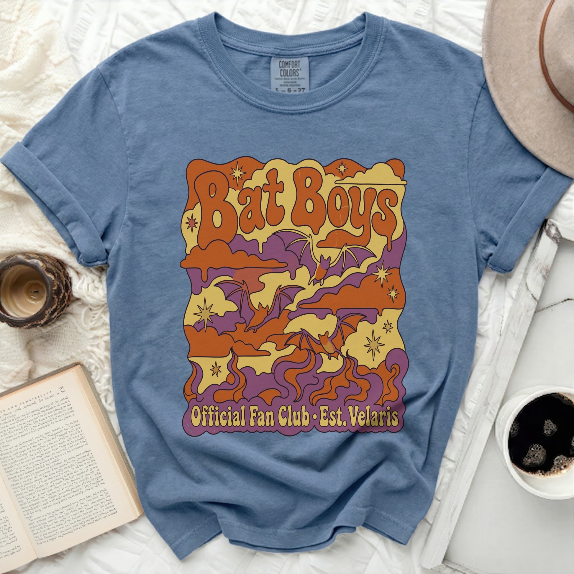 Blue t-shirt with "Bat Boys Official Fan Club Est. Velaris" text and bats.