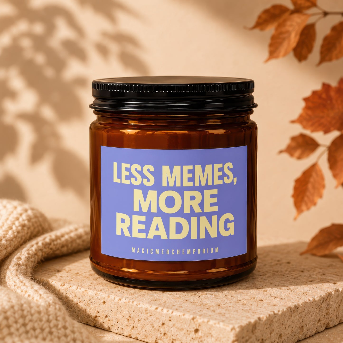 Amber glass candle with label reading "LESS MEMES, MORE READING" and "MAGICMERCHEMPORIUM".