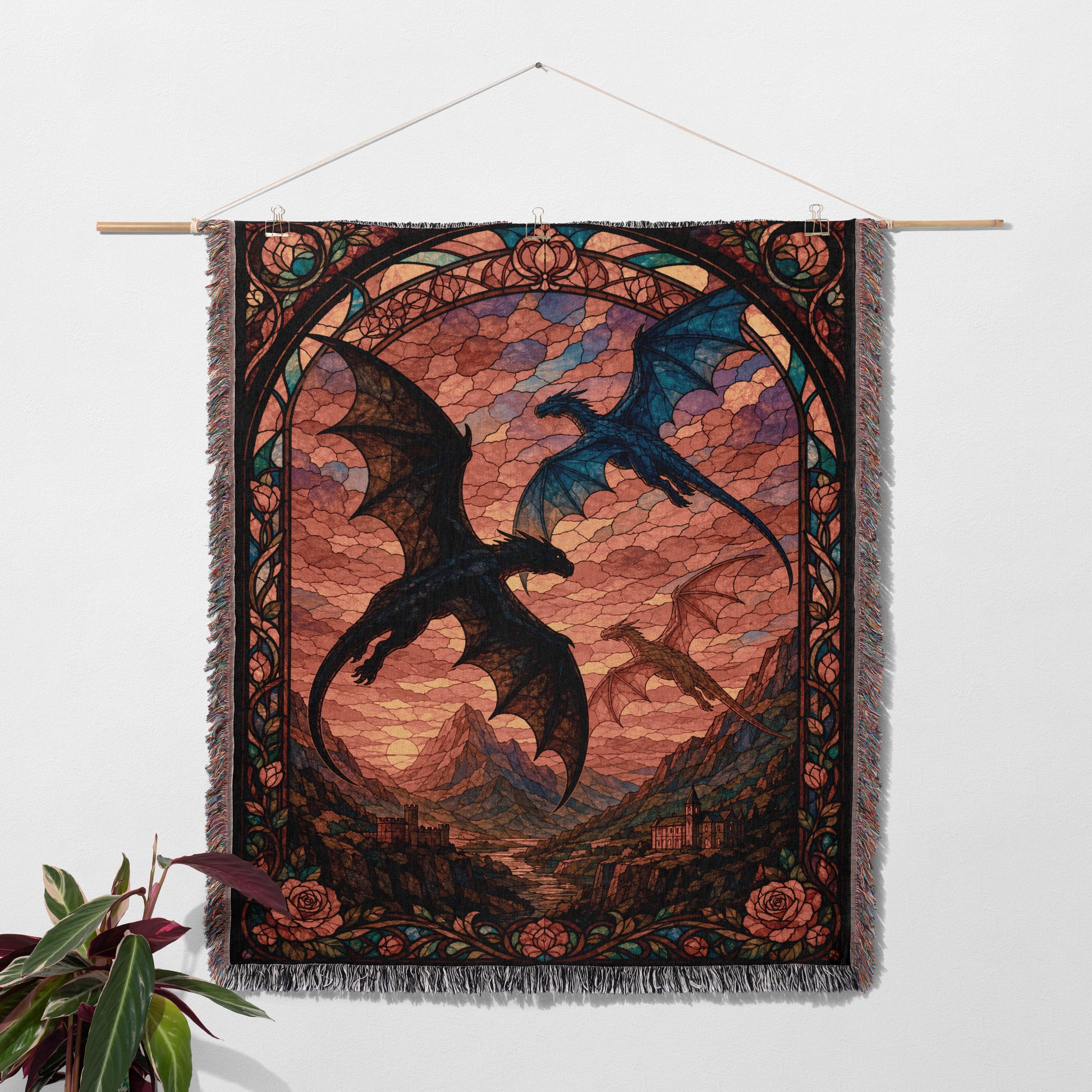 a tapestry hanging on a wall, depicting a fantastical scene with two dragons soaring through a mountainous landscape under a cloudy sky.