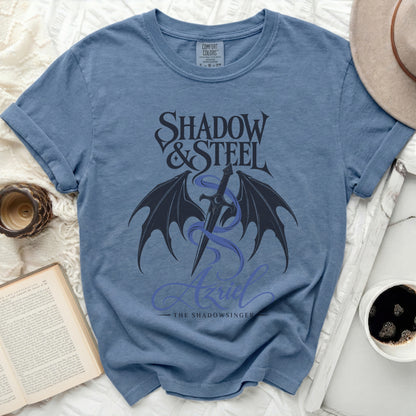 Blue t-shirt with "Shadow & Steel Azriel The Shadowsinger" text and dragon wings graphic.