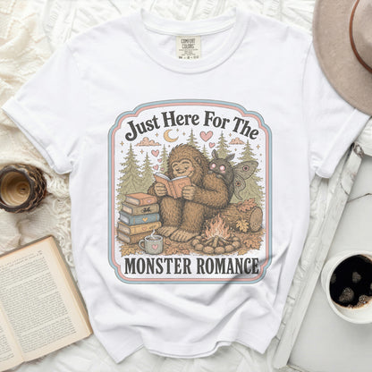 White t-shirt with Bigfoot and moth reading "Just Here For The Monster Romance" graphic.