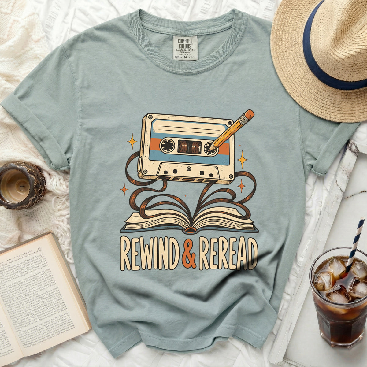 T-shirt with "Rewind & Reread" text, cassette tape, and book graphic.