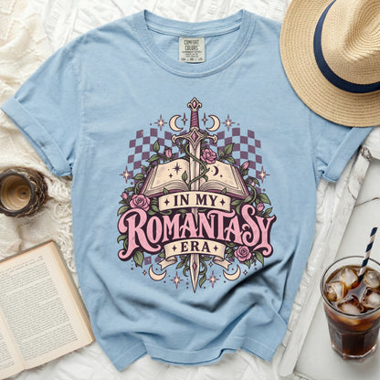 Light blue t-shirt with "In My Romantasy Era" text and fantasy graphic.