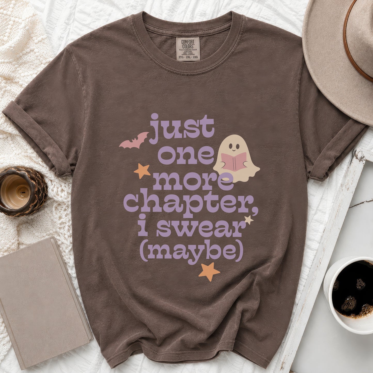 Brown t-shirt with "just one more chapter, i swear (maybe)" text and ghost.