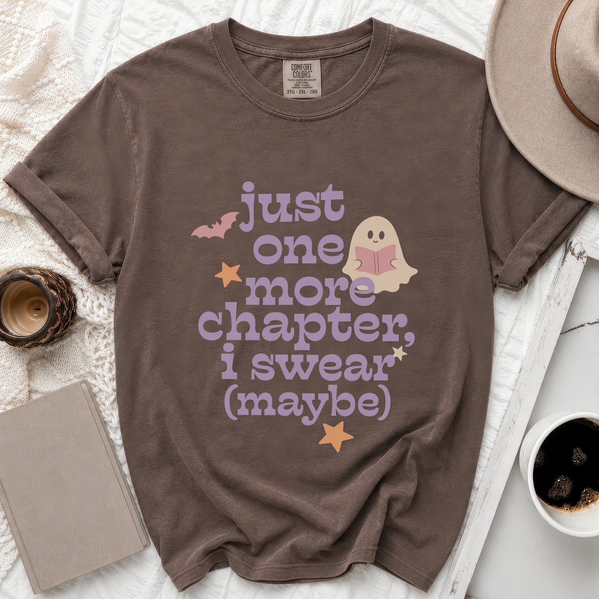 Brown t-shirt with "just one more chapter, i swear (maybe)" text and ghost.