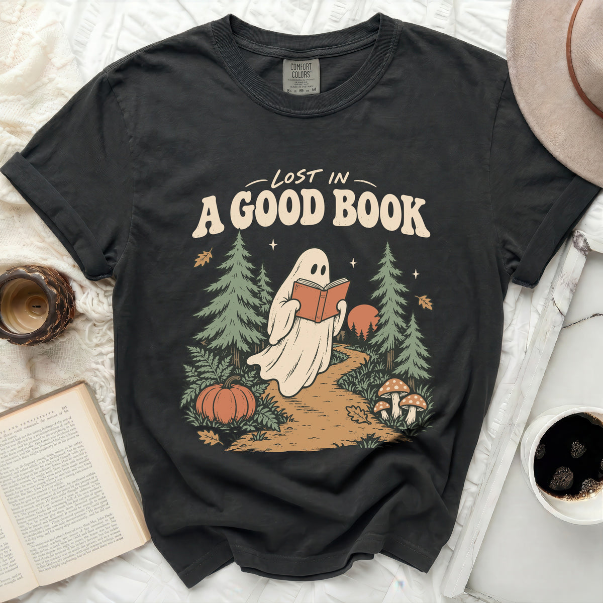 Ghost reading a book in a forest with "Lost in a good book" text.