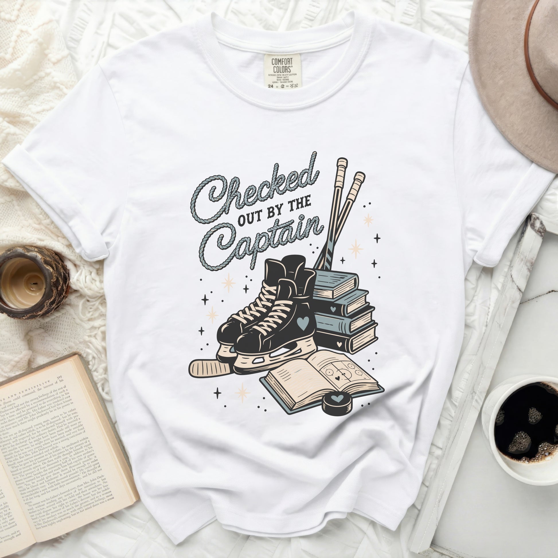 White t-shirt with hockey skates, books, and text "Checked Captain Out By The".