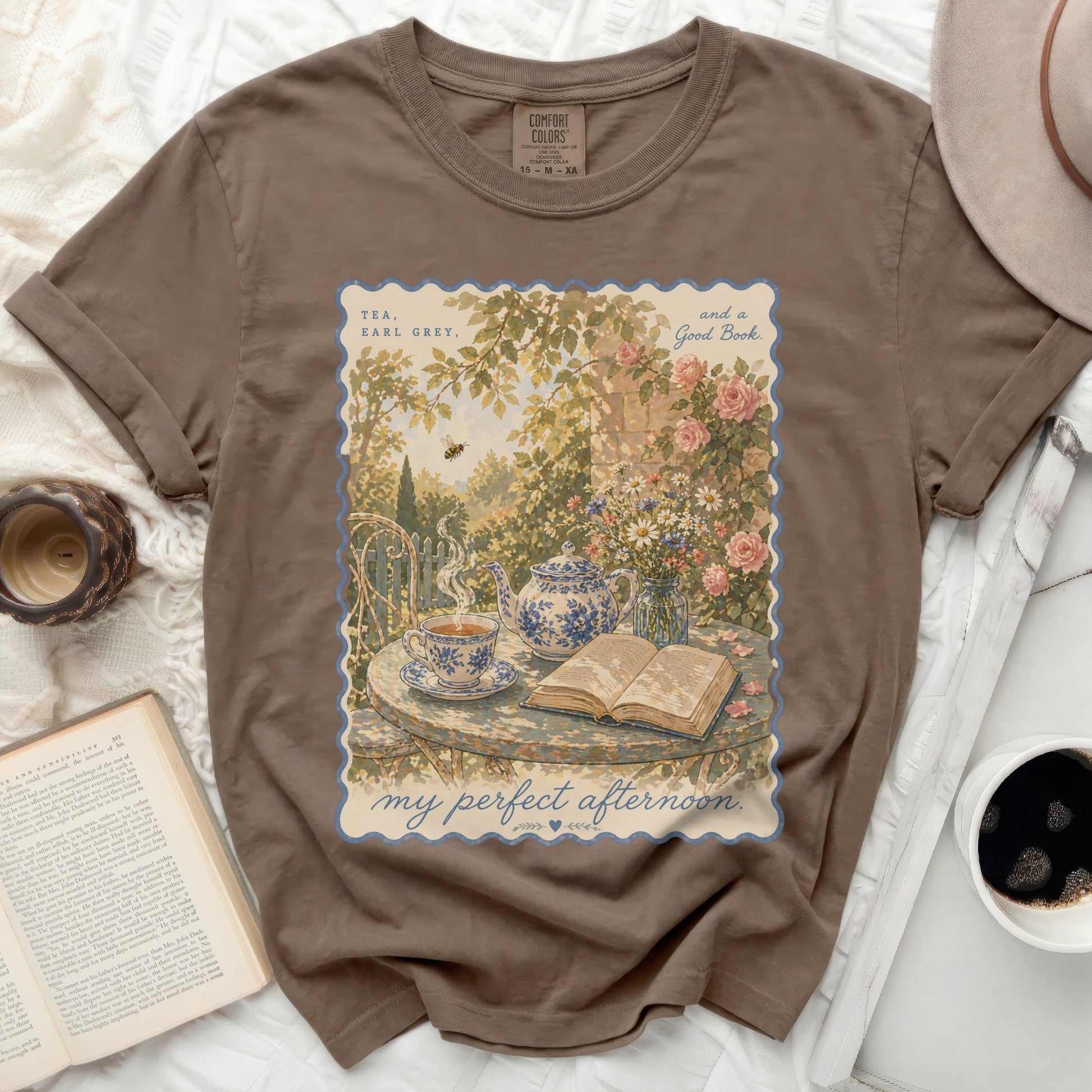 T-shirt with "Tea, Earl Grey, and a Good Book" print and a garden scene.
