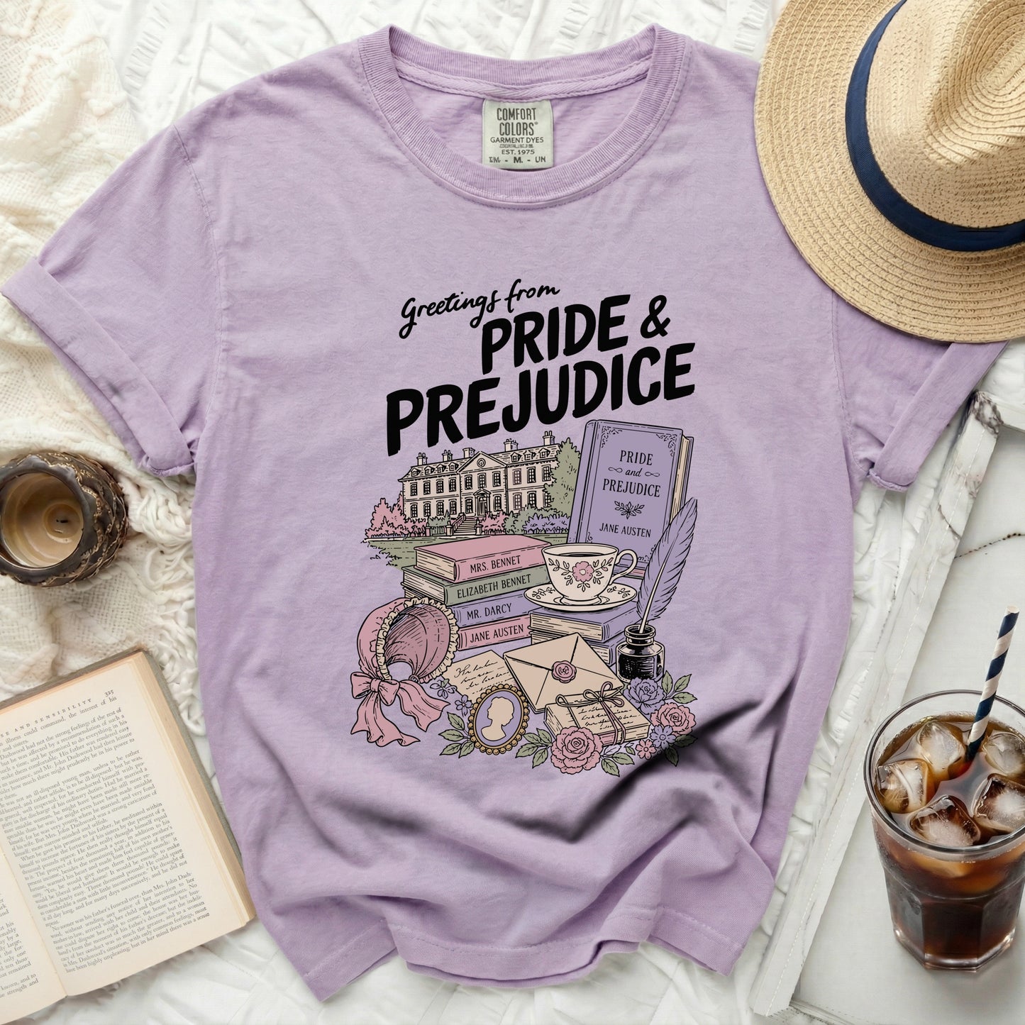 Greetings from Pride & Prejudice t-shirt with illustrations of books and a manor.