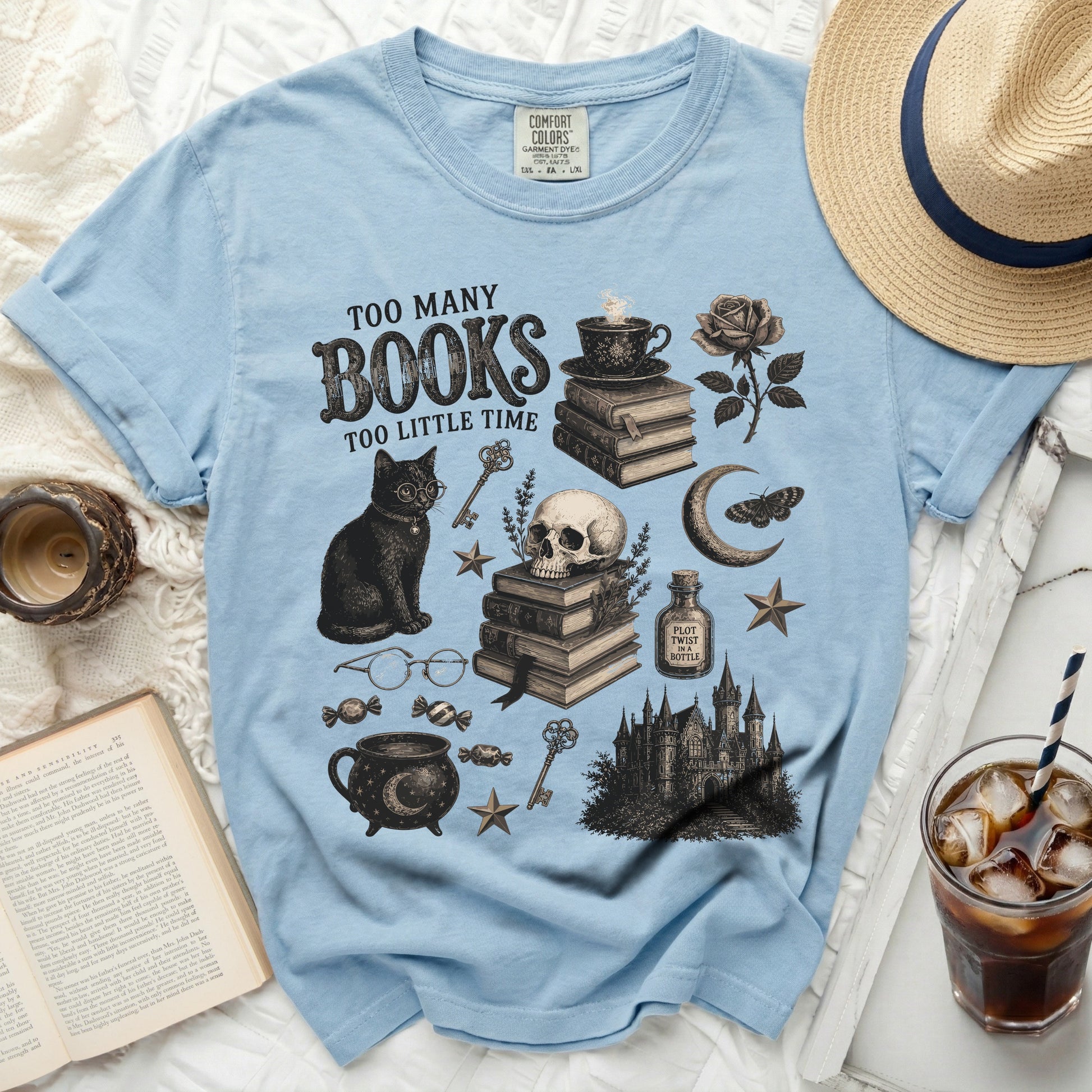 Light blue t-shirt with "Too Many Books Too Little Time" and gothic illustrations.