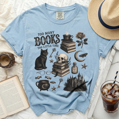 Light blue t-shirt with "Too Many Books Too Little Time" and gothic illustrations.