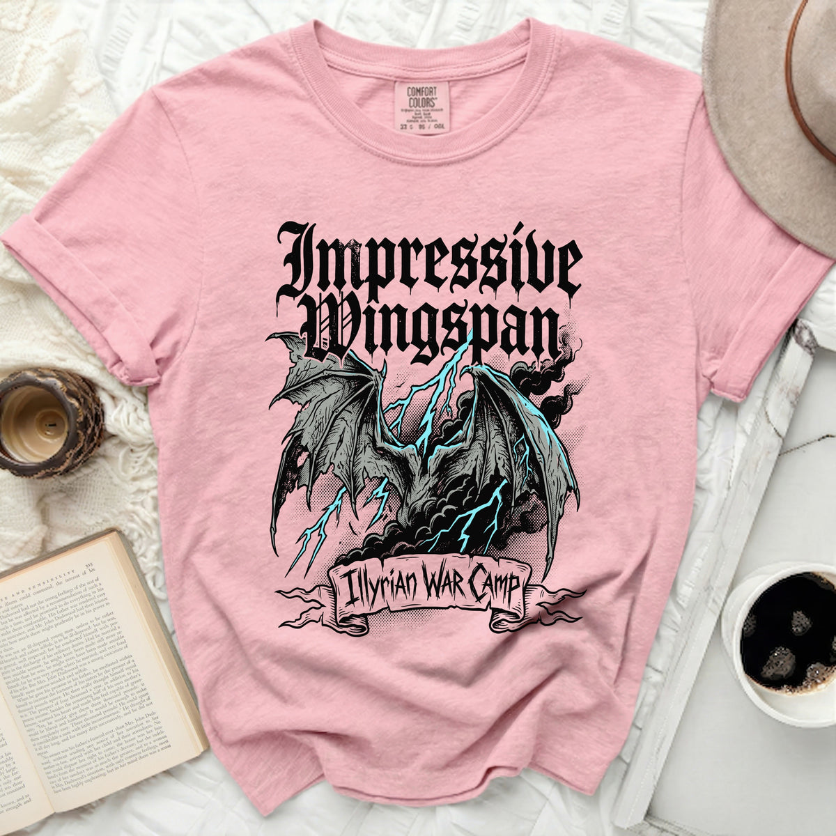 Pink t-shirt with dragon and lightning graphic, text "Impressive Wingspan" and "Illyrian War Camp".