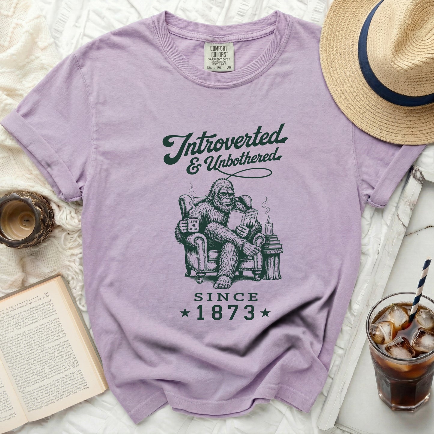 Lavender t-shirt with Bigfoot reading, "Introverted & Unbothered Since 1873".