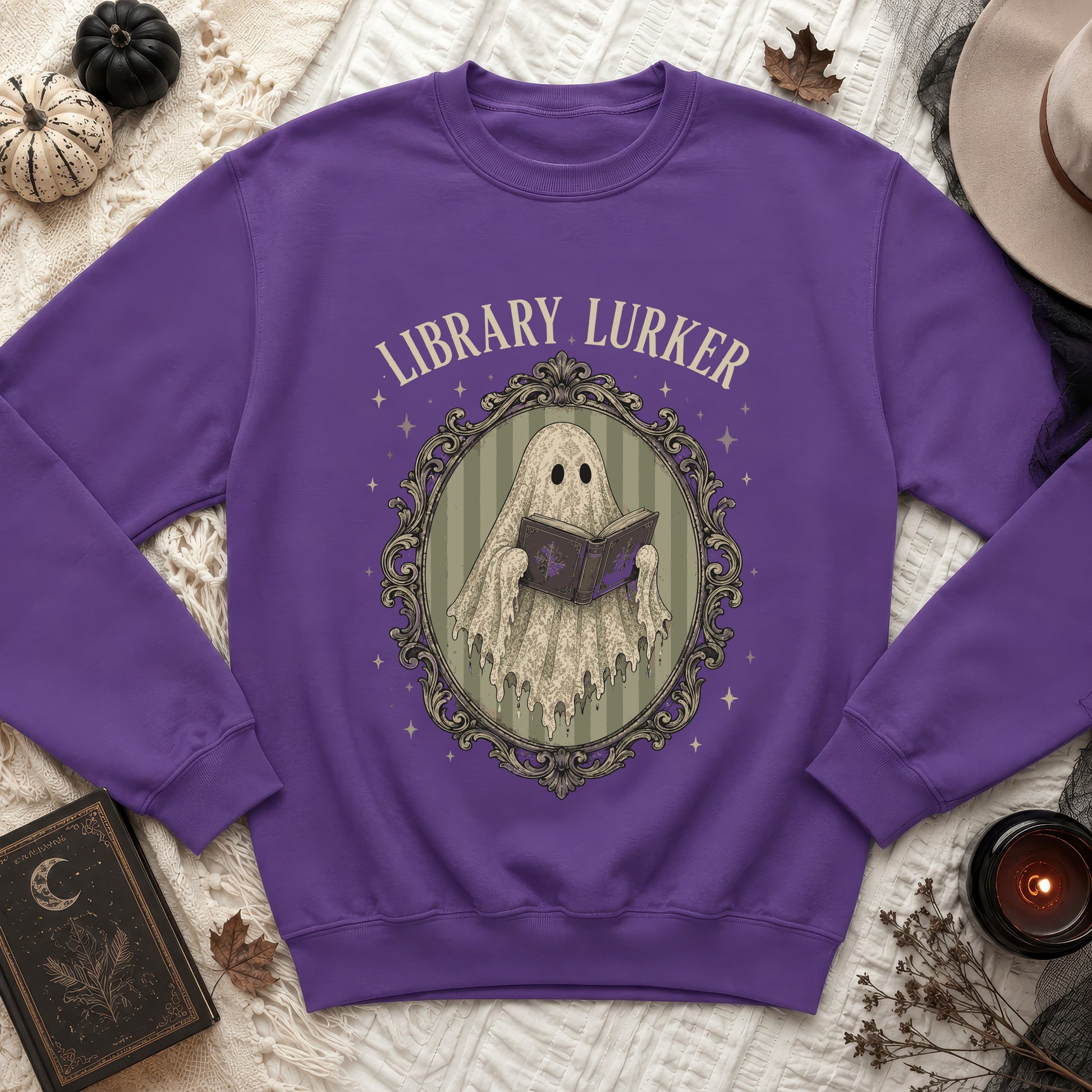 Purple sweatshirt with "Library Lurker" text and a ghost reading a book.