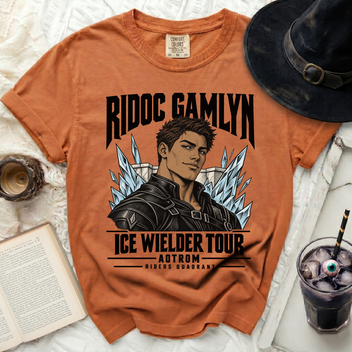 Orange t-shirt with "Ridoc Gamlyn Ice Wielder Tour" graphic featuring a man and ice shards.