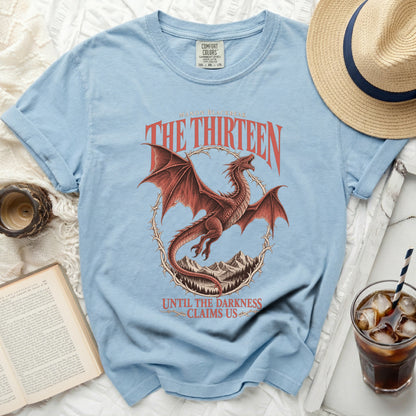 Light blue t-shirt with red dragon, "Manon Blackbeak The Thirteen" and "Until the Darkness Claims Us" text.