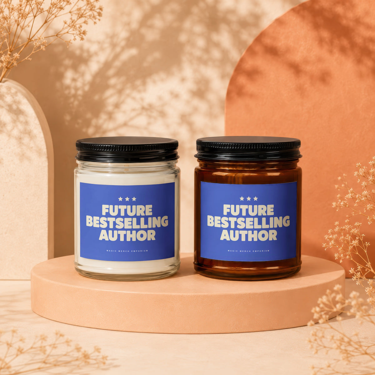 Two candles, one clear and one amber glass, with "Future Bestselling Author" labels.