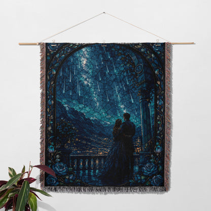 a tapestry hanging on a wall, depicting a couple standing together under a night sky filled with shooting stars.