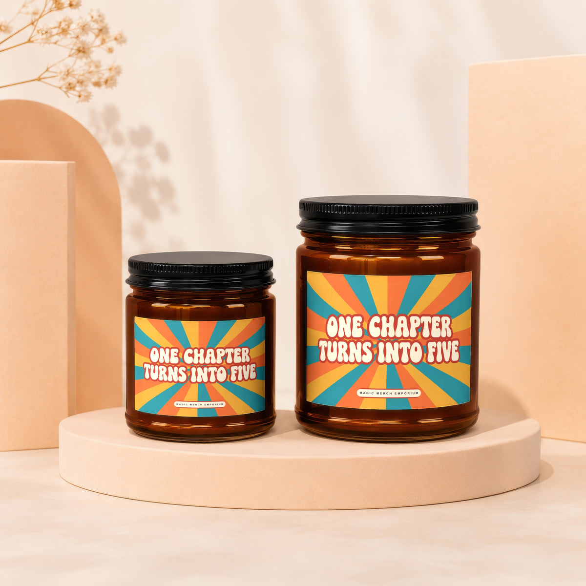 Two glass jars with black lids, featuring retro sunburst labels that read "One Chapter Turns Into Five."