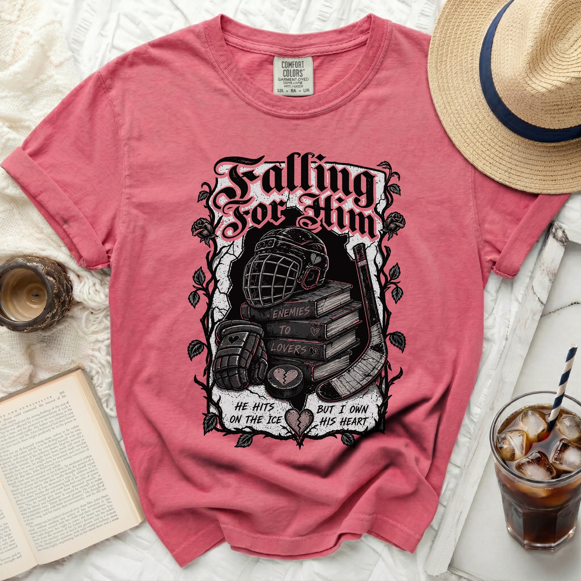 T-shirt with "Falling For Him" text, hockey puck, and stick.