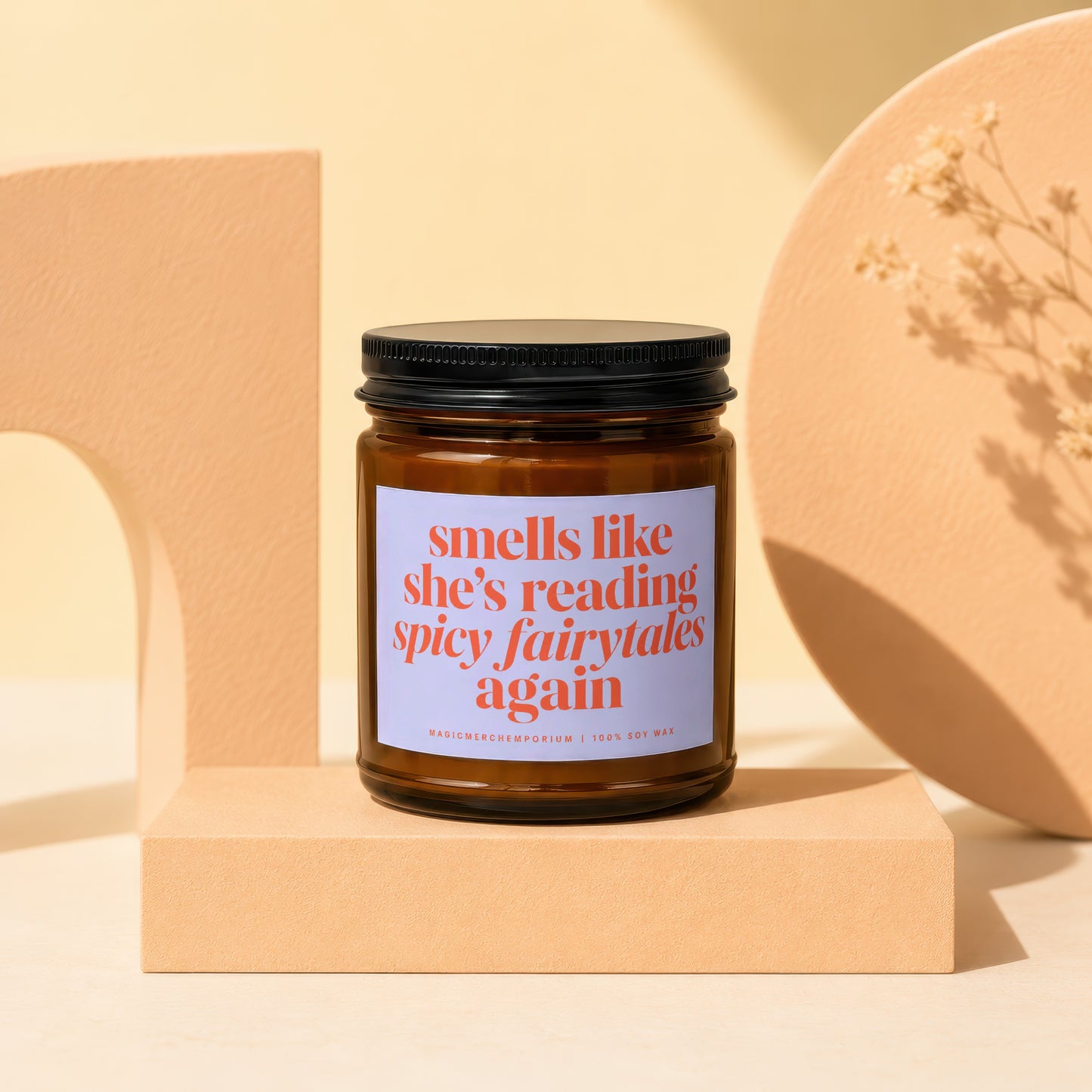 Candle with black lid, label reads "smells like she's reading spicy fairytales again"
